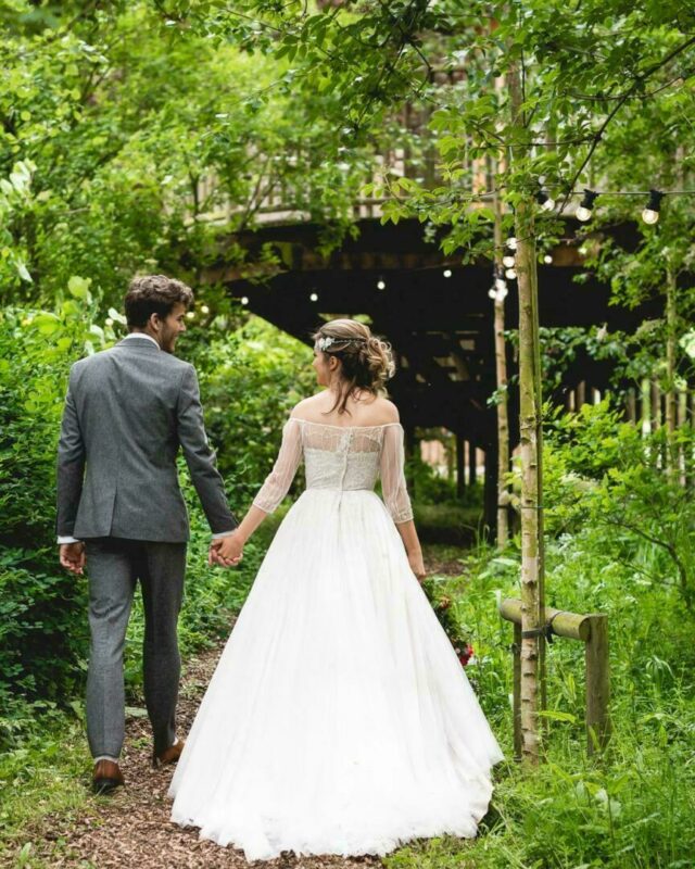 bride and groom in wedding venue grounds