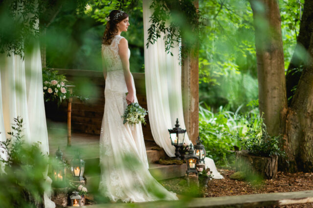 Hideaway with bride standing with flowers